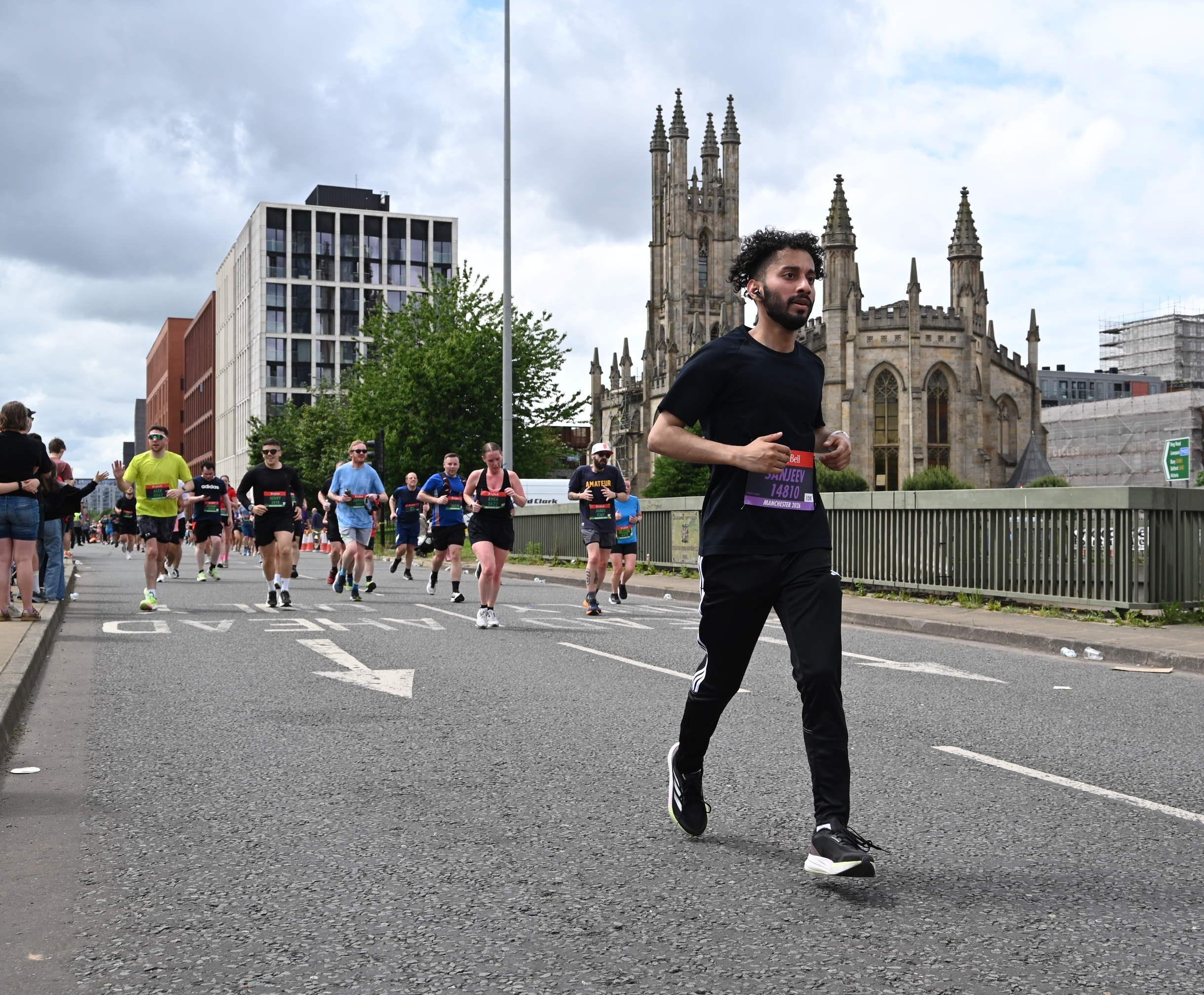 Racing past Manchester Cathedral during the AJ Bell Great Manchester Run 10K